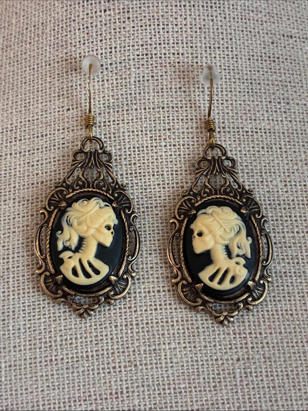 Skeleton Lady black and ivory relief resin cameo dangle wire earrings brass tone